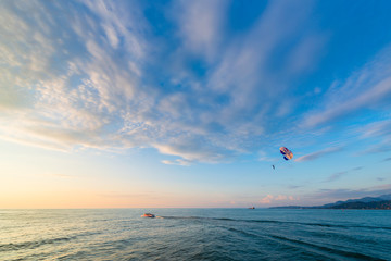 Flying baloon over the Black Sea with amazing sunset sky
