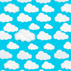 Pattern of paper clouds on a blue background.