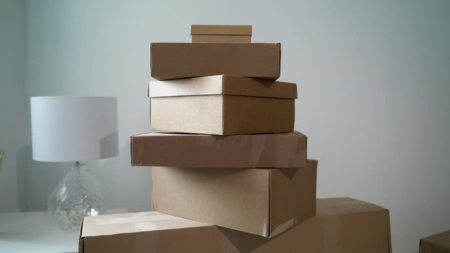 Moving or relocation to new house apartment or office. Cardboard boxes unpacking
