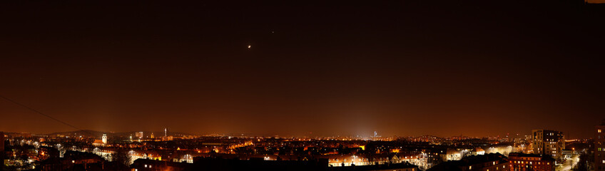 Fototapeta na wymiar Light pollution over the city of Gdansk - Moon and Venus flushed by city lights.
