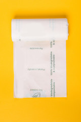Biodegradable package isolated on the yellow backround. Eco friendly.