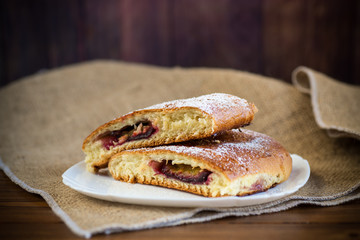 sweet baked homemade plum cake with icing sugar