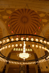 Naklejka premium MANAMA, BAHRAIN - JUNE 26: A splendid interior of the Al Fateh Grand Mosque on June 26, 2017, Manama, Bahrain. Al Fateh mosque is one of the largest mosque in the world