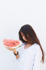 Pre-teen girl eating watermelon. Happy childhood. Summer girl.