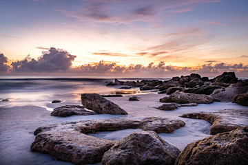 Sunrise Florida Beach with boulders