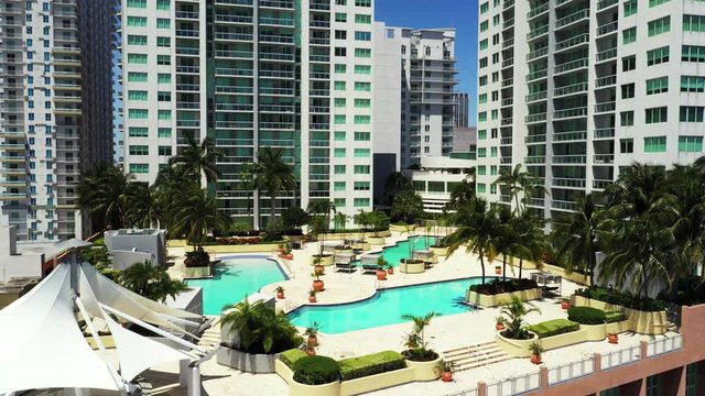 Aerial reveal swimming pool at Vizcayne Condominium Downtown Miami FL