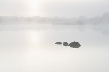 Sunrise with fog in the natural park of Los Barruecos. Extremadura. Spain.