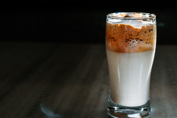 Closeup shot of Dalgona coffee in glass on a table