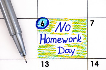 Reminder No Homework Day in calendar with pen