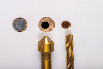 Drilling in a furniture board. Making a hole and countersinking for a metal screw.