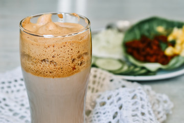 Dalgona coffee besides the Indian breakfast