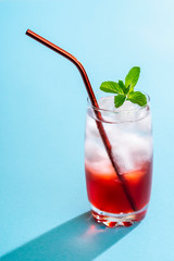 Summer drink with strawberry syrup and mineral water