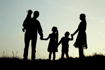 silhouette of a happy family with children