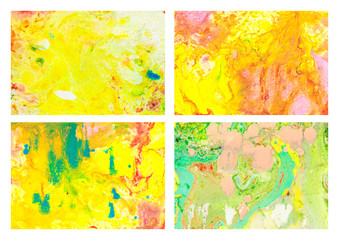 Set of abstract backgrounds with gold, pink, orange, green stains and spots.
