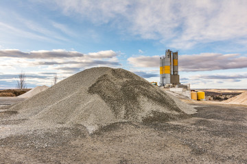 Quarry for the extraction of sand and stone, its transformation into gravel and cement manufacturing