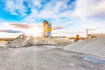 Quarry for the extraction of sand and stone, its transformation into gravel and cement manufacturing - obrazy, fototapety, plakaty