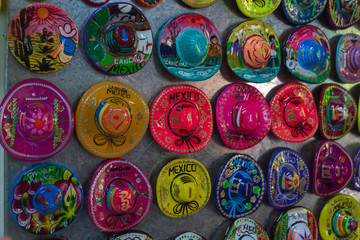 Souvenir magnet display in Cancun Local Fair. Colorful sombreros are inexpensive and easy to bring...