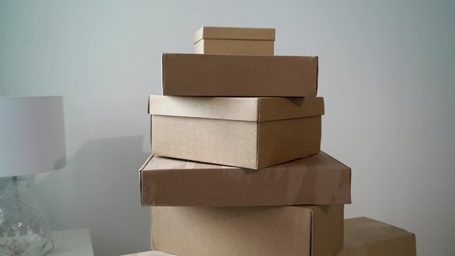 Moving or relocation to new house apartment or office. Cardboard boxes unpacking