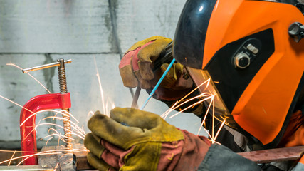 Welders working at the plant produce metal structures