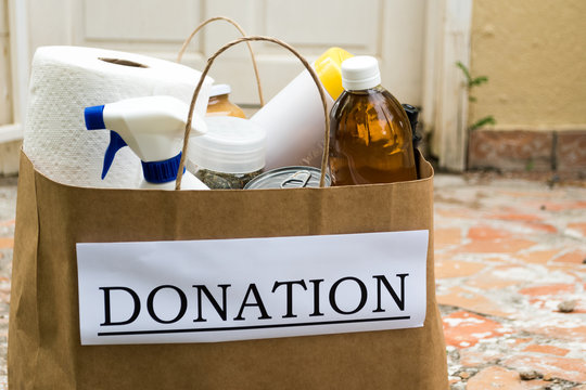 Community Care And Charity: A Donation Bag Is Delivered To A Front Door During The Covid -1 19 Pandemic