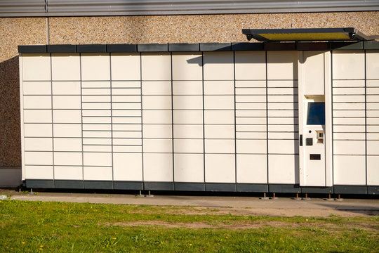 Boxes for parcels and letters on the street, an automatic machine for delivering parcels or ending machine or dispenser. Self-service post terminal machine or locker to deposit