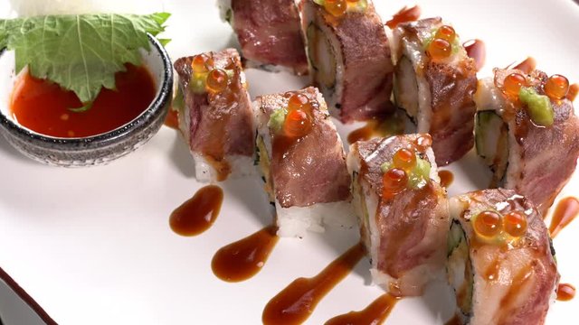 Japanese food sushi wagyu on a turn table .