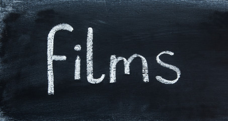 Films - in a word - for film and movie buffs, education, teaching & inspiration - in panorama / header / banner, written in real chalk letters on a chalkboard.