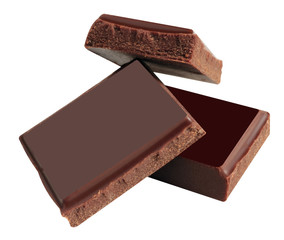Delicious black chocolate shavings and pieces on white background, top view