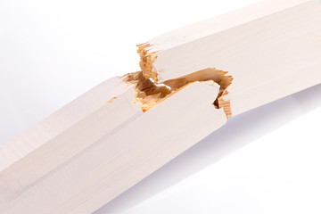 New broken wooden board on a white background close-up