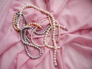 Necklaces, pendants and amulets made of precious stones and metals