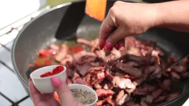 Chef roasts the meat and sprinkles it with flavorings