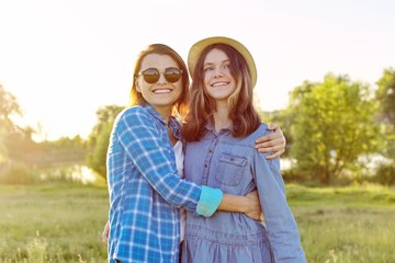 Fototapeta premium Portrait of happy smiling hugging daughter and mother. Mothers day