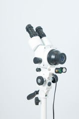 Colposcope on a white background in the gynecological office