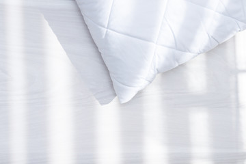 White hypoallergenic pillow in sunny day, sunlight. Allergy dust mite concept. - obrazy, fototapety, plakaty