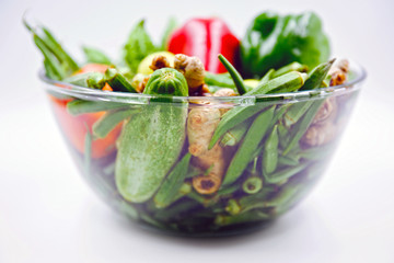 Vegetables soaked in a bowl of clean water for the purpose of disinfecting them.
