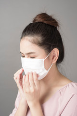 close up woman face is wearing surgical mask