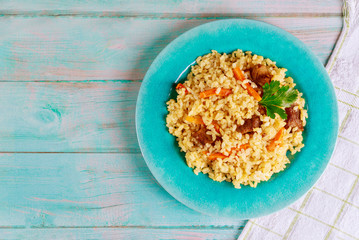 Arabic dish with rice, meat, carrot and pita bread.