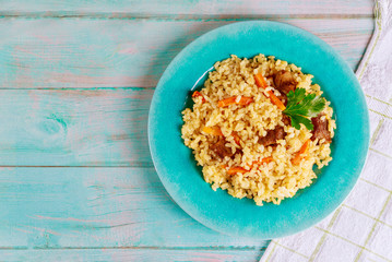 Arabic dish with rice, meat, carrot and pita bread.