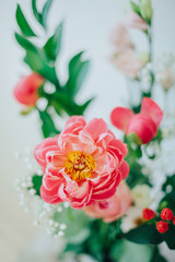 Bouquet of beautiful peonies in a vase on the table. Lovely flowers.