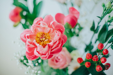 Bouquet of beautiful peonies in a vase on the table. Lovely flowers.