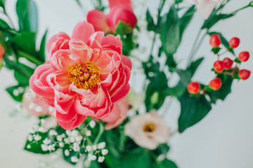 Bouquet of beautiful peonies in a vase on the table. Lovely flowers.