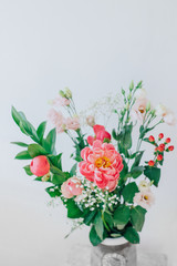 Bouquet of beautiful peonies in a vase on the table. Lovely flowers.