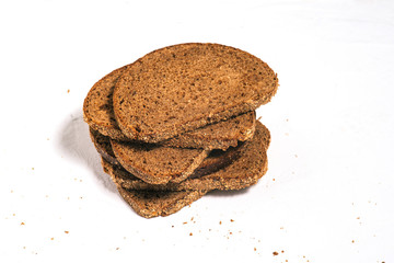 Sliced bread isolated on a white background. Slices of bread on a table lined with a pyramid.