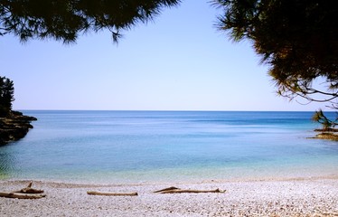 Beautiful blue sea bay with pebble beach