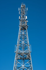 Communication tower with clear blue sky