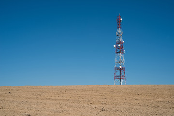 Communication tower with clear blue sky