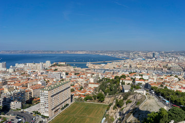 Fototapeta na wymiar The amazing areal view on Marseille from mountain where is church od Notre Dame de la Guarde , France