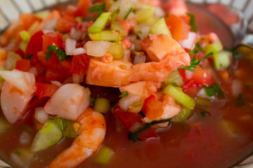 delicious plate of ceviche with shrimp, scallops, octopus, cucumber and lemon juice and clam juice a wealth of Latin American food