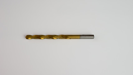 metal drill gold color on white background