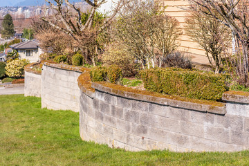 Fence built from trees and stones. Outdoor landscape. Security and privacy concept. Vancouver. Canada.